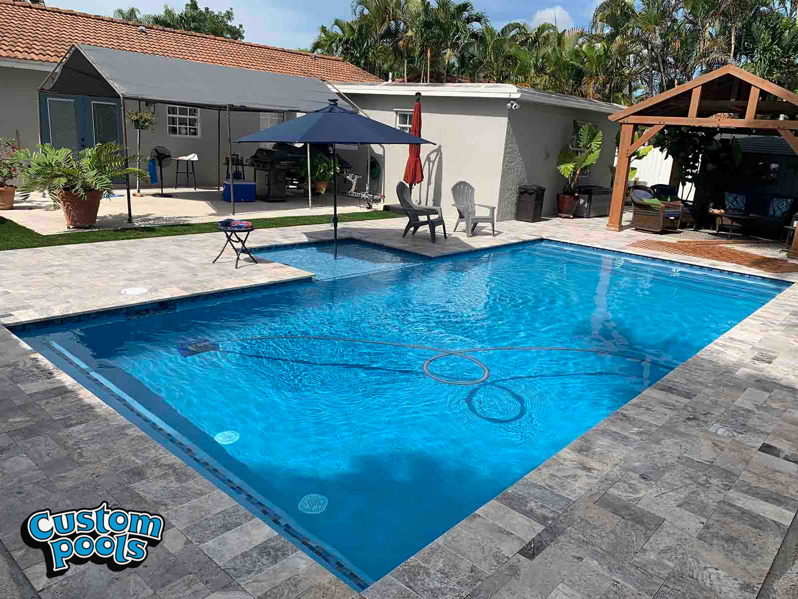 Inground Pool with Sunshelf and Hawaiin Blue Plaster 35k to 40k by Custom Pools